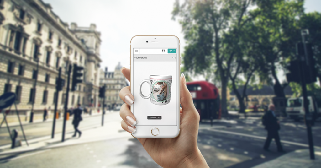 Taopix Creator with Photo-gift on mobile device and woman's hand